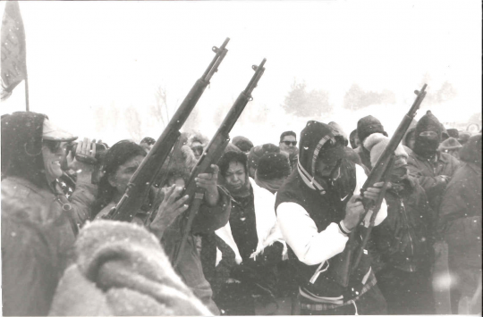 Gun salute during the twenty-fifth anniversary of the Wounded Knee occupation