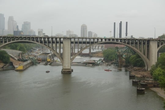 View of the I-35W bridge wreckage in the Mississippi looking through the arches of the Tenth Avenue bridge in Minneapolis. Photograph by Kevin Rofidal (Edina Police Department), August 4, 2007.