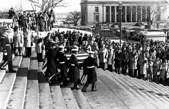 Black and white photograph of color Guard officers carrying the body of Hubert H. Humphrey down the steps of the Minnesota State Capitol in St. Paul, January 1978.