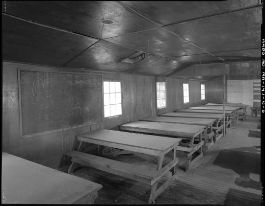 Classroom in the education building (Building 7), CCC Camp Rabideau F-50. Photo by Jerry Mathiason, 1994. From box 1 (144.G.8.4F) of Historic American Buildings Survey records related to Minnesota structures, 1882-2001, 1883. Manuscripts Collection, Minnesota Historical Society, St. Paul.