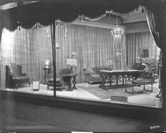 Black and white photograph of furniture window display, c.1920.