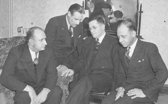 Black and white photograph of Governor Elmer Benson (center right) at a conference with American Gas Machine Company strike representatives in Albert Lea, 1937.