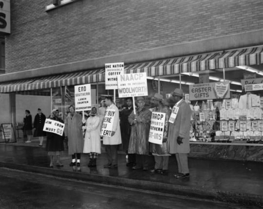 Black and white photograph of NAACP members picketing outside Woolworth’s for integrated lunch counters, St. Paul, 1960.