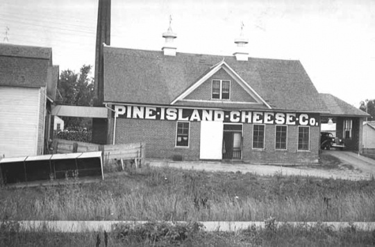 Black and white photograph of Pine Island Cheese Co., 1937.