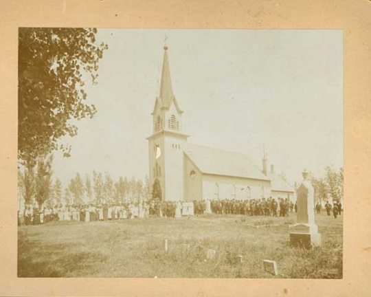 Congregation standing outside Swedish Lutheran Church in Svea Township