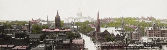 Black and white photograph of St. Paul looking up Cedar Street toward the third capitol building. The tower of the second capitol is visible left of center, 1904. Photographed by Francis L. Wright.