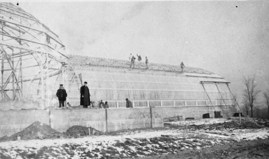 Black and white photograph depicting construction of the conservatory, ca. 1915.