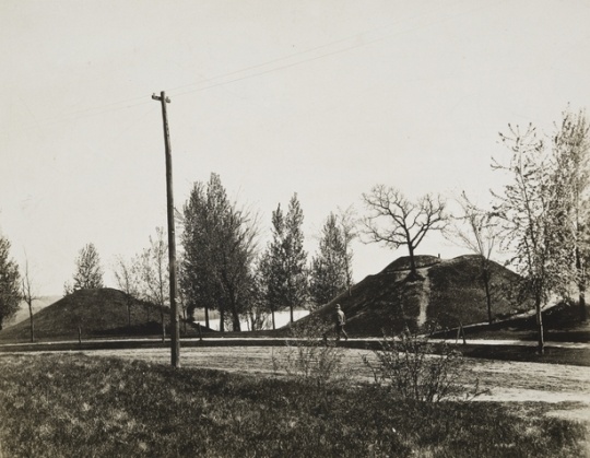 Black and white photograph of two of the mounds, with walking path, at Indian Mounds Park, ca. 1900.