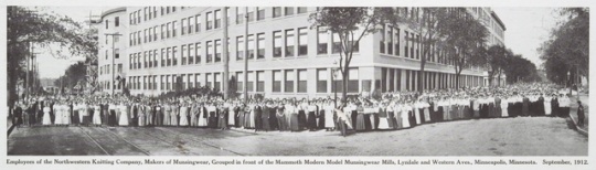 Employees of the Northwestern Knitting Company, makers of Munsingwear, grouped in front of the Mammoth Modern Model Munsingwear Mills, Lyndale and Western Avenues, Minneapolis
