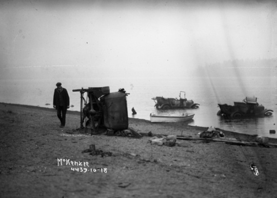 Black and white photograph of automobiles in Moose Lake after fire, 1918.