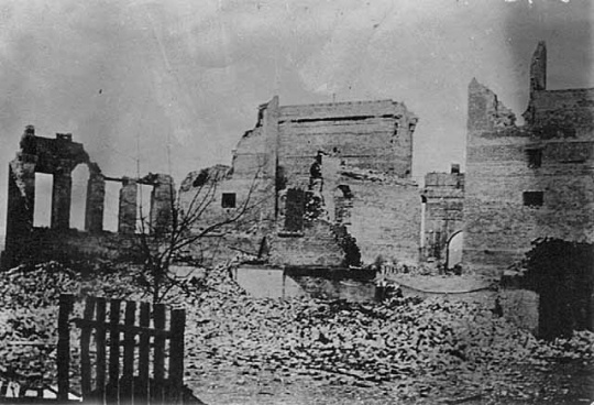 Black and white photograph of scene in Cloquet after the fire, 1918.