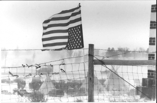 Upside-down American flag flying at Wounded Knee