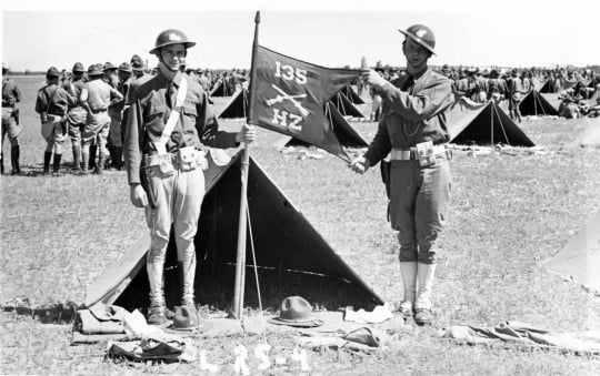Black and white photograph of Moe Jones and Einar Lund of Stillwater’s Howitzer Company, 135th Infantry, during a field inspection at Camp Ripley, 1935.