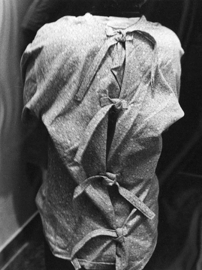 Inmate wearing a restricting shirt