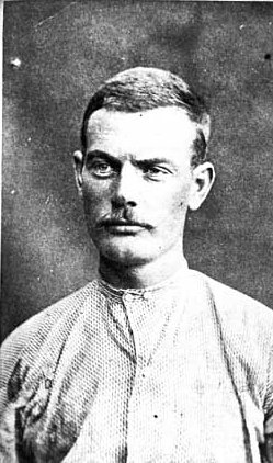 Black and white photograph of Bob Younger after being captured outside Madelia, September 1876. Photographed by Jacoby’s Art Gallery.