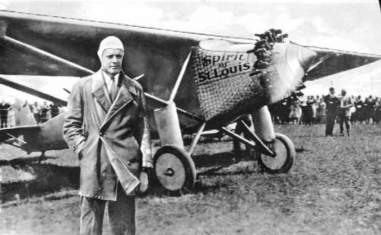 Black and white photograph of Charles Augustus Lindbergh with the Spirit of St. Louis, c.1927.